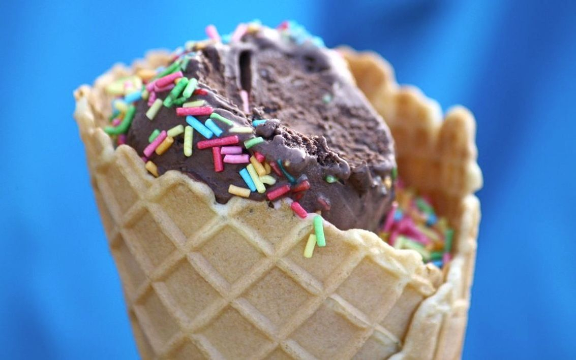 The front of the ice cream parlor on a sunny corner